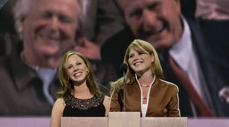 President Bush's daughters, Barbara, left, and Jenna Bush, are framed by their grandparents, former President George H. W. Bush, right, and Barbara Bush as they speak to delegates at Madison Square Garden during the Republican National Convention in New York, Tuesday, Aug. 31, 2004. (AP Photo/Stephan Savoia)