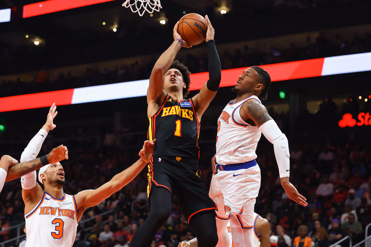 Atlanta Hawks forward Jalen Johnson (1) goes up to shoot against New York Knicks guards Josh Hart (3) and Miles McBride, right, during the first half of an NBA basketball game, Monday, April. 6, 2026, in Atlanta. (Colin Hubbard/AP)