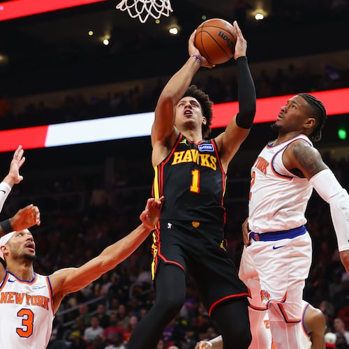 Atlanta Hawks forward Jalen Johnson (1) goes up to shoot against New York Knicks guards Josh Hart (3) and Miles McBride, right, during the first half of an NBA basketball game, Monday, April. 6, 2026, in Atlanta. (Colin Hubbard/AP)