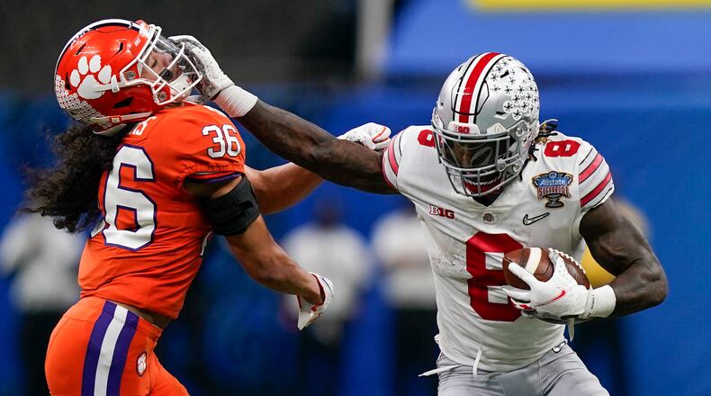 Ohio State running back Trey Sermon runs past Clemson safety Lannden Zanders during the first half of the Sugar Bowl Friday, Jan. 1, 2021, in New Orleans. (Gerald Herbert/AP)