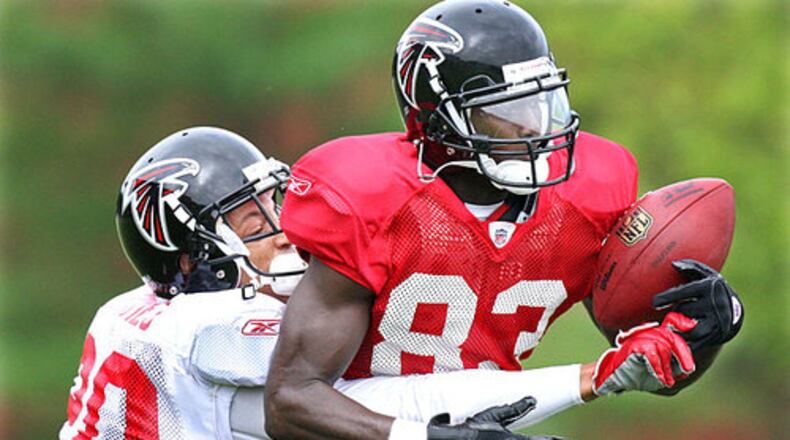 Cornerback Brent Grimes (20) breaks up a pass to wide receiver Harry Douglas (83). Douglas,now retired, handles pre-games duties on 92.9 The Game.