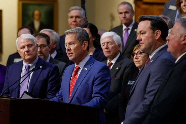 Governor Brian Kemp, flanked by Lieutenant Governor Burt Jones, Speaker of the House Jon Burns, and Insurance Commissioner John King, answers questions during a press conference at the Georgia Capitol’s north wing on Jan. 15, 2025. Governor Kemp wants to expand Medicaid to cover parents of young children. (Miguel Martinez/AJC)