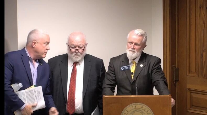 Bill White, a leader of the Buckhead cityhood movement, left, confers with Republican state Sen. Randy Robertson, right, at a recent Senate committee meeting. (Image via state Senate video)