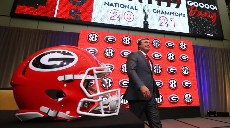 Georgia head coach Kirby Smart takes the stage for his press conference at SEC Media Days with 2021 National Champions flashing on the screen in the College Football Hall of Fame on Wednesday, July 20, 2022, in Atlanta. (Curtis Compton / Curtis Compton@ajc.com)