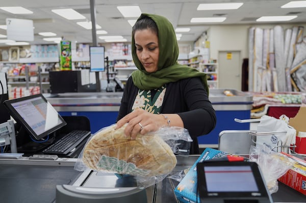Locals shop at the Finest Supermarket halal grocery store in Fredericksburg, Va., on Monday, April 7, 2025. (AP Photo/Jessie Wardarski)