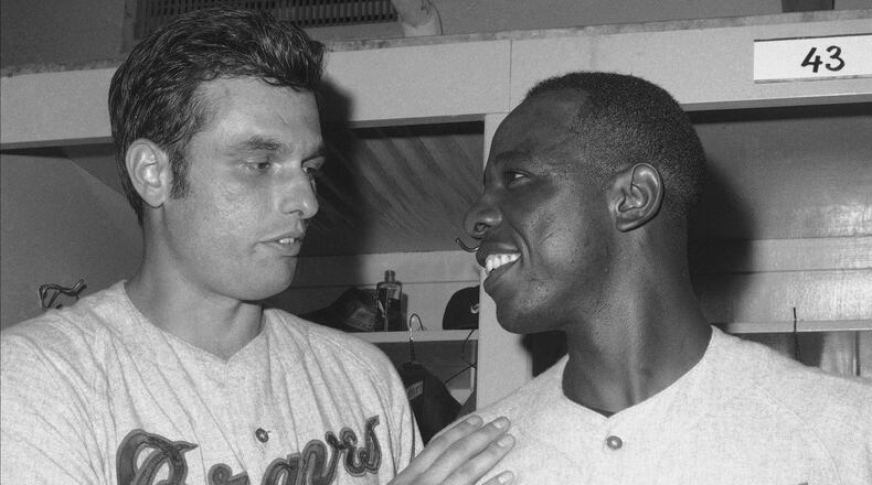 Milt Pappas (left) and Hank Aaron of the Braves celebrate a win over the Mets in 1968. (AP Photo/Marty Lederhandler)