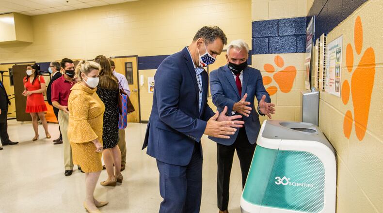 Iggy, 30e Scientific's hand washing station, was installed in the Bryant Elementary School cafeteria in Mableton. The sanitation station uses aqueous ozone to rinse hands in seven seconds before students pick up their school lunches. (Jenni Girtman for The Atlanta Journal-Constitution)