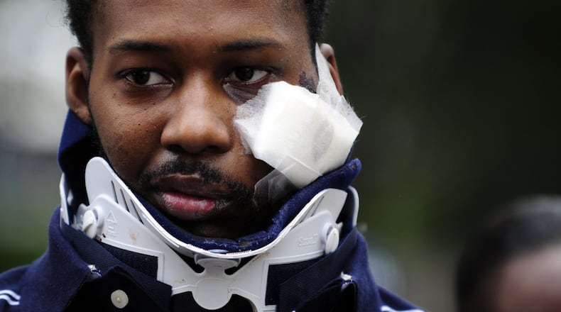 Tramaine Miller, who was shot in the face by off-duty Atlanta police Officer Reginald Fisher, leaves Grady Memorial Hospital in May 2009. The bullet remains lodged in Miller’s neck today. ELISSA EUBANKS/eeubanks@ajc.com
