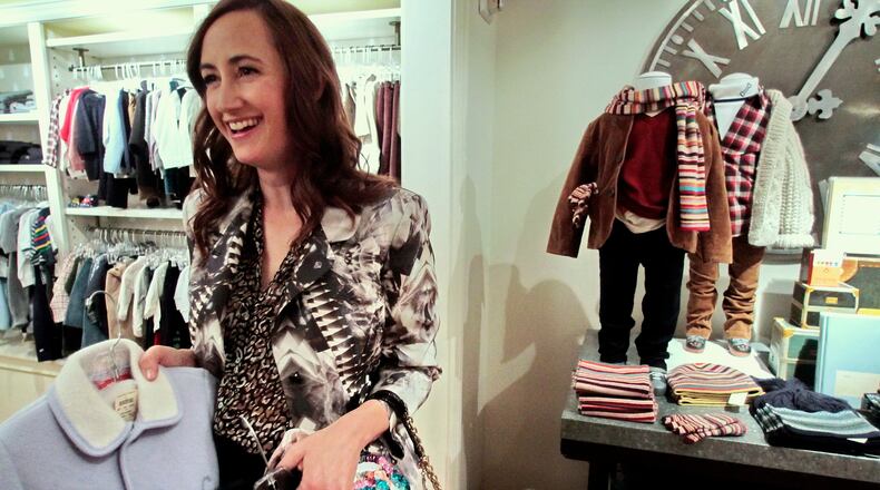 FILE - Author Sophie Kinsella shops in the children's section at Bergdorf Goodman in New York, Tuesday, Sept. 21, 2010. (AP Photo/Bebeto Matthews, File)