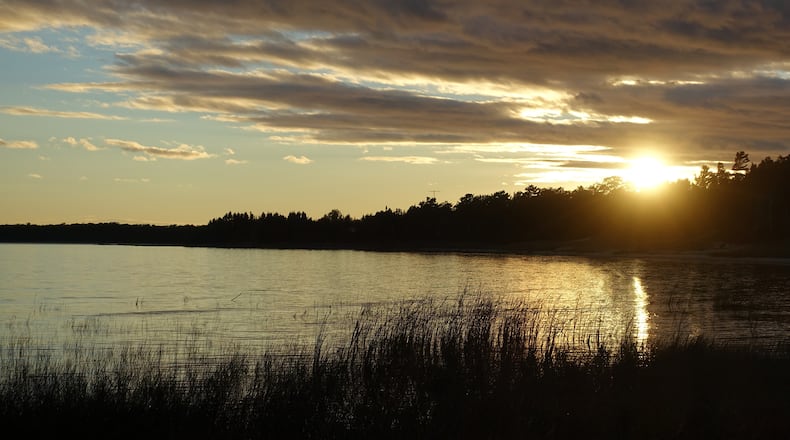 The sun sets over still waters near Washington Island's Sand Dunes Park. (Kurt Chandler/Chicago Tribune/TNS)