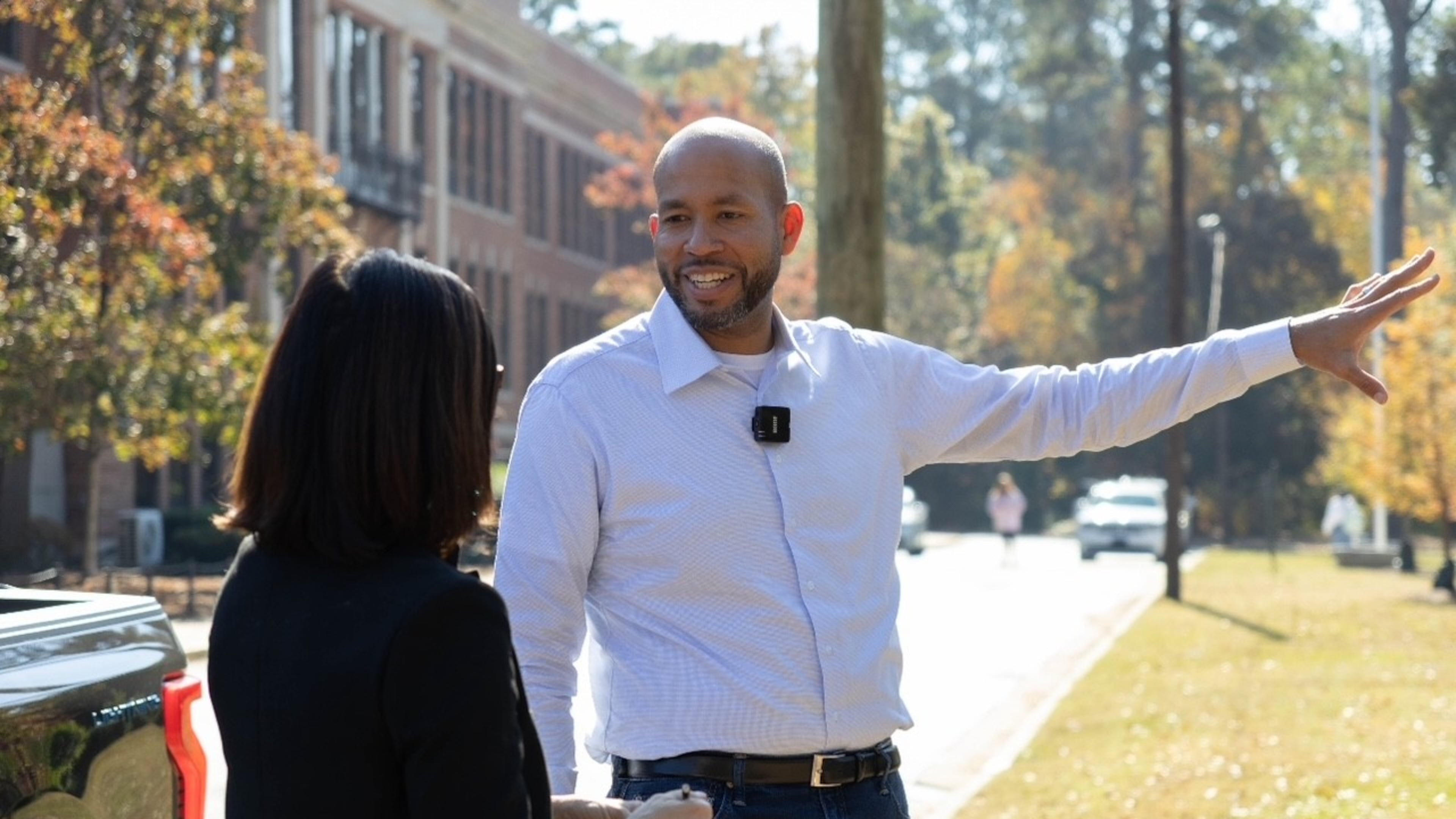 Former state Sen. Jason Esteves' Democratic campaign for governor is focused on economic opportunity. He said attending North Columbus High School (in background) opened opportunities that friends at other Columbus schools did not have. (Anna Girzone for the AJC)