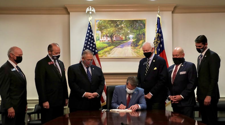 Gov. Brian Kemp signs into law voting rights bill SB202 on Thursday behind closed doors at the Georgia Capitol.