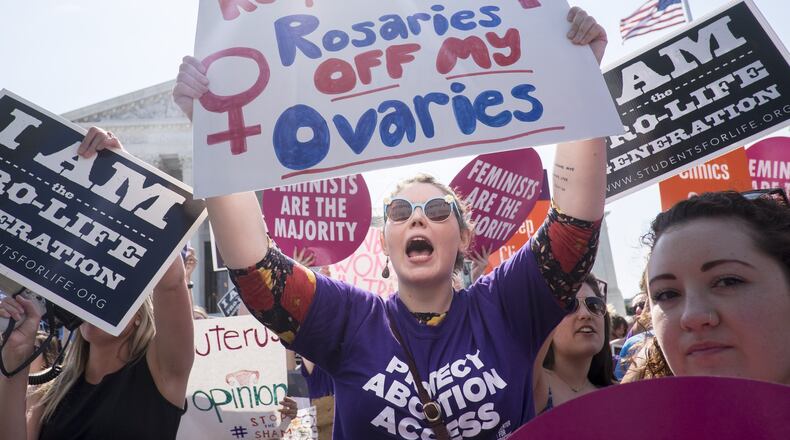WASHINGTON, DC - JUNE 27: Pro-choice activists celebrate on the steps of the United States Supreme Court on June 27, 2016 in Washington, DC. In a 5-3 decision, the U.S. Supreme Court struck down one of the nation’s toughest restrictions on abortion, a Texas law that women’s groups said would have forced more than three-quarters of the state’s clinics to close. (Photo by Pete Marovich/Getty Images)