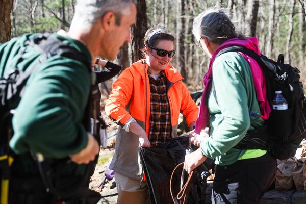 Cat Hosch hands volunteers lunches Saturday on Blood Mountain at Byron Reece Memorial Trail. More than 100 people from several states joined this past weekend in the search for her father. (Abbey Cutrer/AJC)