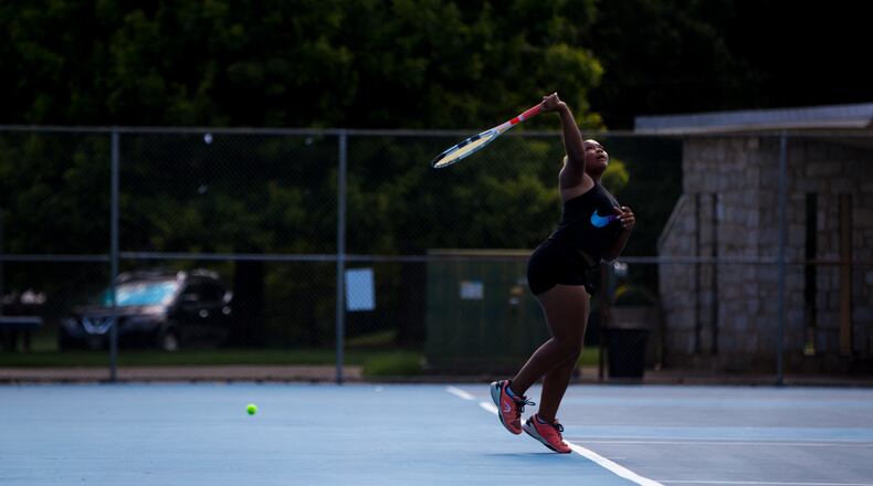Telain Bivins, 16, hits the ball while playing in a USTA sanctioned tennis match at Sharon Lester Tennis Center in Atlanta, Ga., on Friday, June 28, 2019. (Casey Sykes for The Atlanta Journal-Constitution)