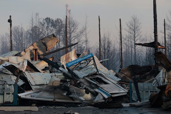 Liberty Door and Awning's 20,000 foot warehouse is damaged from a wildfire in Forked River, N.J., on Wednesday, April 23, 2025. (Elizabeth Robertson /The Philadelphia Inquirer via AP)