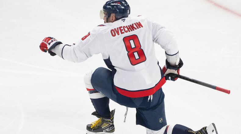 Washington Capitals' Alex Ovechkin reacts following his goal over the Montreal Canadiens during first-period NHL hockey game action in Montreal, Thursday, Nov. 20, 2025. (Christinne Muschi/The Canadian Press via AP)
