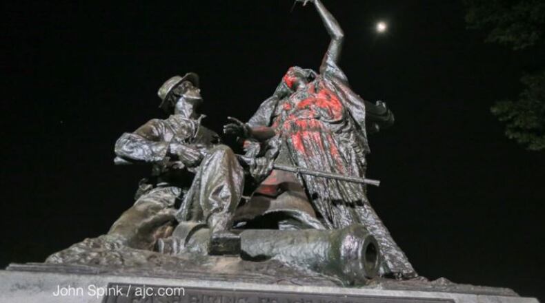 During a rally against symbols of the Confederacy this summer in Atlanta, demonstrators threw paint on the Peace Monument in Piedmont Park. Johns Spink/AJC