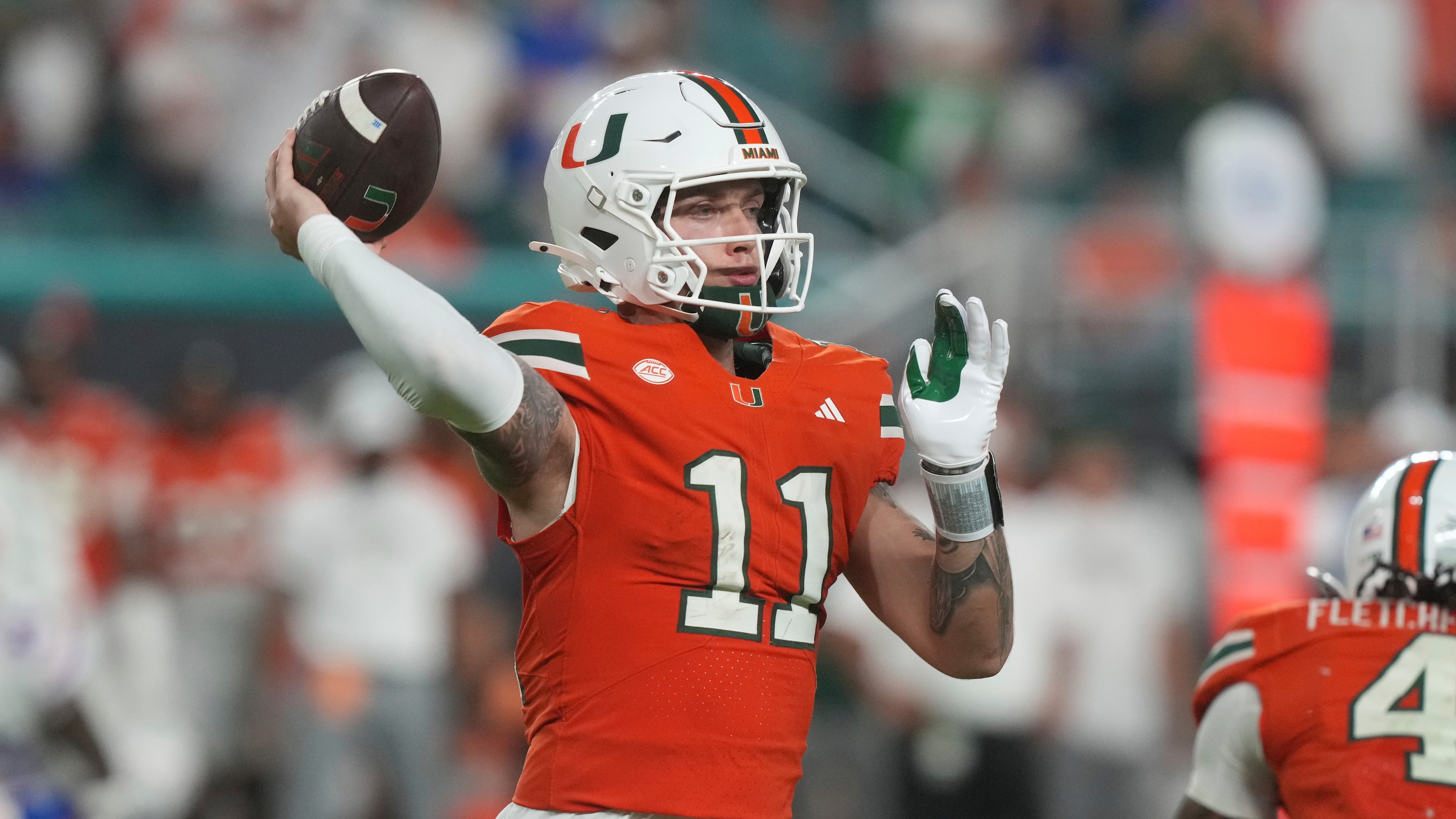 Miami quarterback Carson Beck (11) aims a pass during the second half of an NCAA college football game against Florida, Saturday, Sept. 20, 2025, in Miami Gardens, Fla. (AP Photo/Marta Lavandier)