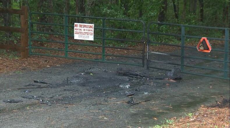 The body was found after someone called 911 and reported a burning car.