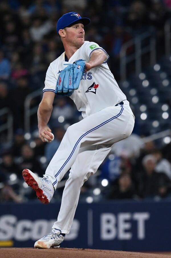 Toronto Blue Jays starting pitcher Chris Bassitt (40) throws to an Atlanta Braves batter in first inning baseball action in Toronto on Wednesday, April 16, 2025. (Jon Blacker/The Canadian Press via AP)