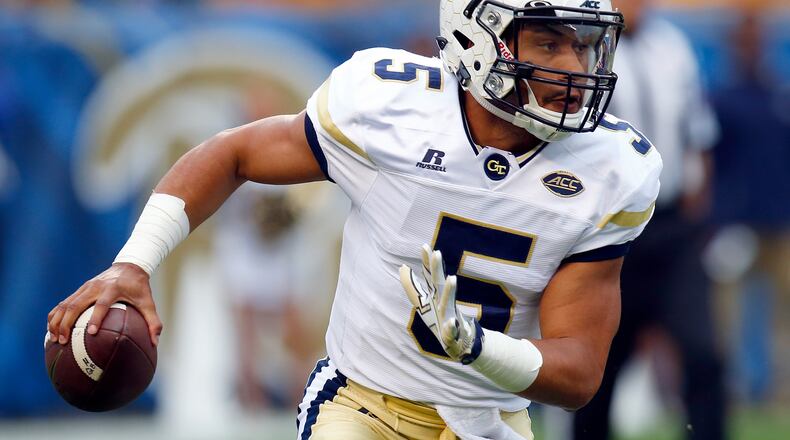 PITTSBURGH, PA - OCTOBER 08: Justin Thomas #5 of the Georgia Tech Yellow Jackets rolls out to pass during the game against the Pittsburgh Panthers on October 8, 2016 at Heinz Field in Pittsburgh, Pennsylvania. (Photo by Justin K. Aller/Getty Images)