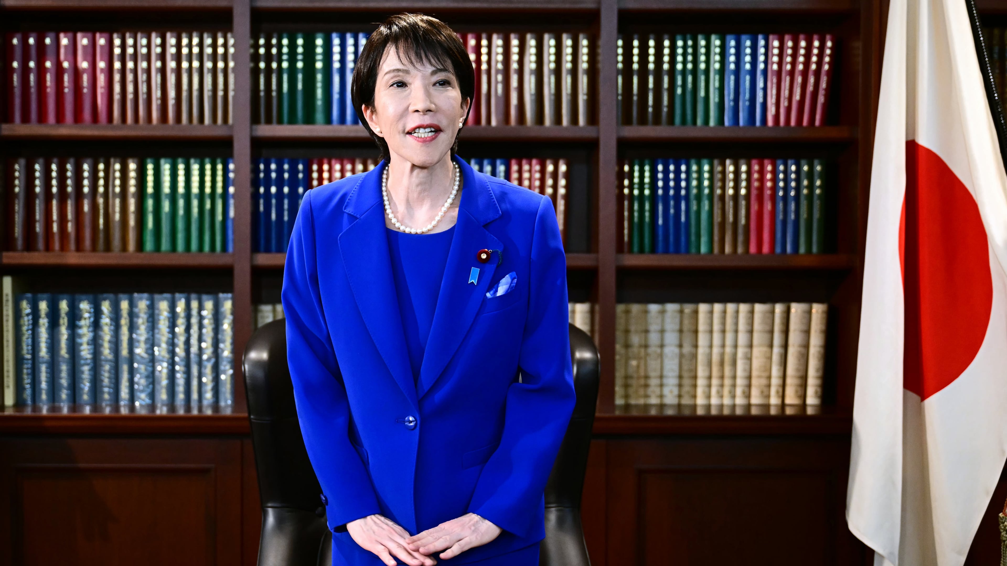 Sanae Takaichi, the newly-elected leader of Japan's ruling party, the Liberal Democratic Party (LDP), gestures as she leaves the party leader's office after the LDP leadership election in Tokyo Saturday, Oct. 4, 2025. (Yuichi Yamazaki/Pool Photo via AP)