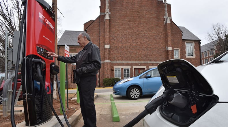 January 26, 2016 Decatur - Don Francis, executive director of Clean Cities Georgia, charges his electric vehicle using DC Fast Charging station at Agnes Scott College electric vehicle charging station on Tuesday, January 26, 2016. DC fast charging provides a rapid recharge of battery electric vehicles, generally in less than 30 minutes. Interest in the factors that influence the adoption of electric vehicle technology has grown in Georgia following the Legislature’s decision to eliminate a $5,000 tax credit and impose a $200 per year registration fees. EV sales have plummeted 90 percent since last June, when the law took effect. HYOSUB SHIN / HSHIN@AJC.COM