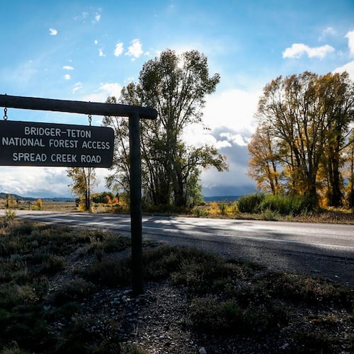 FILE - A sign gives directions to the Bridger-Teton National Forest on Sept. 19, 2021 in Wyoming. (AP Photo/Amber Baesler, File)