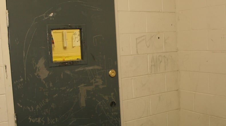This metal door locked Jonathan King into a seclusion room at one of Georgia's "psychoeducational" programs for students with behavioral and emotional disabilities. Jonathan hanged himself in this room in 2004. (Photo by Gainesville Police Department.)