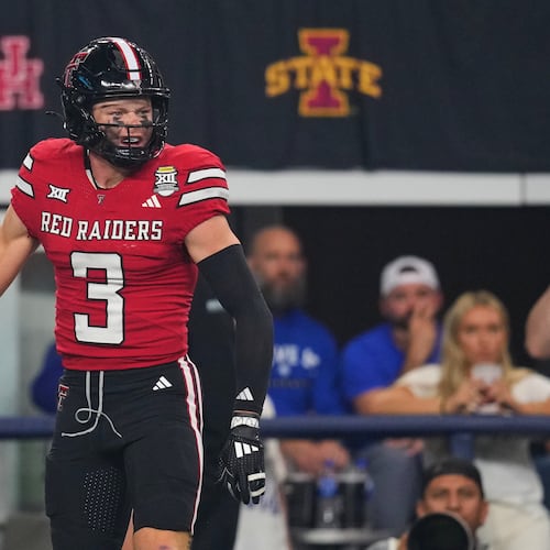 Texas Tech wide receiver Coy Eakin celebrates after catching a touchdown pass in the first half of a Big 12 Conference championship NCAA college football game against BYU Saturday, Dec. 6, 2025, in Arlington, Texas. (AP Photo/Julio Cortez)