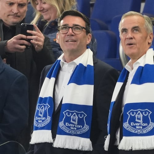 Britain's Prime Minister Andy Burnham, left, and Canada's Prime Minister Mark Carney attend the League Cup third round round soccer match between Everton and Wolverhampton Wanderers, Wednesday, Sept. 16, 2026, in Liverpool, England. (Peter Byrne/PA via AP)