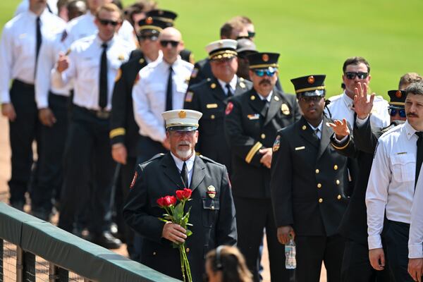 Firefighters arrive to pay their respects to fallen DeKalb County firefighter Preston Fant. (Hyosub Shin/AJC)