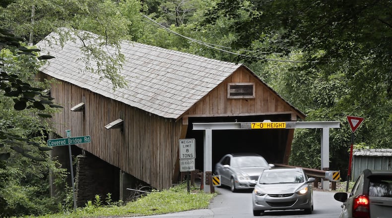 June 20, 2019 - Smyrna - June 20, 2019 - Smyrna - Cobb County’s covered bridge gets a second warning device to stop drivers from running into the historic covered bridge on Concord Road. It will join the older warning device seen here, which is made of steel beams to absorb a blow from a too-tall vehicle. Bob Andres / bandres@ajc.com