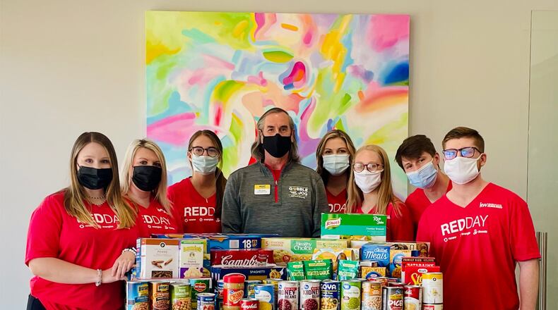 The Janice Overbeck Real Estate Team of Keller Williams recently collected about 590 food items for MUST Ministries.