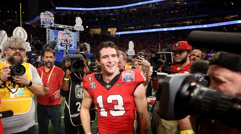 Georgia quarterback Stetson Bennett celebrates after his team's 42-41 win against Ohio State in the Peach Bowl. (Jason Getz / Jason.Getz@ajc.com)