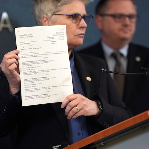 FILE - Hennepin County attorney Mary Moriarty holds up a document containing charges against ICE agent Christian Castro during a news conference at the Hennepin County Government Center in Minneapolis, on Monday, May 18, 2026. (Renée Jones Schneider/Minnesota Star Tribune via AP,File)