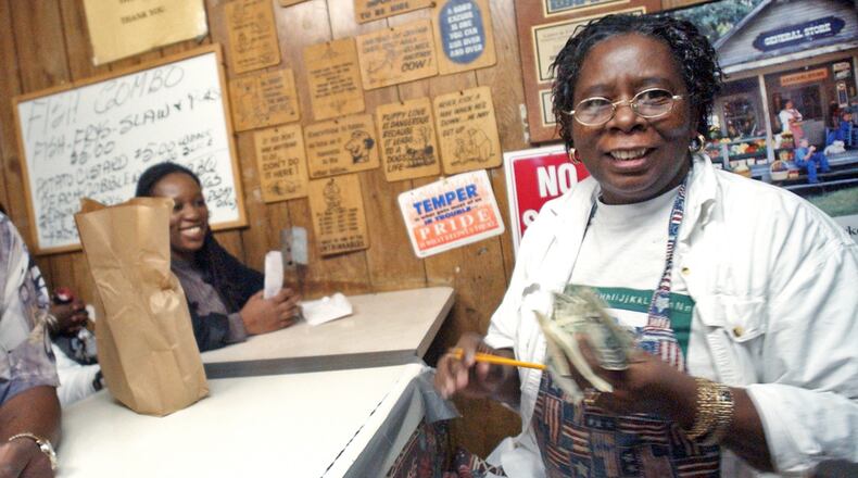 Frankie Rich, right, takes orders from customers at Bankhead Fish and Soul -- also known as Bankhead Seafood -- in 2006. / AJC file photo