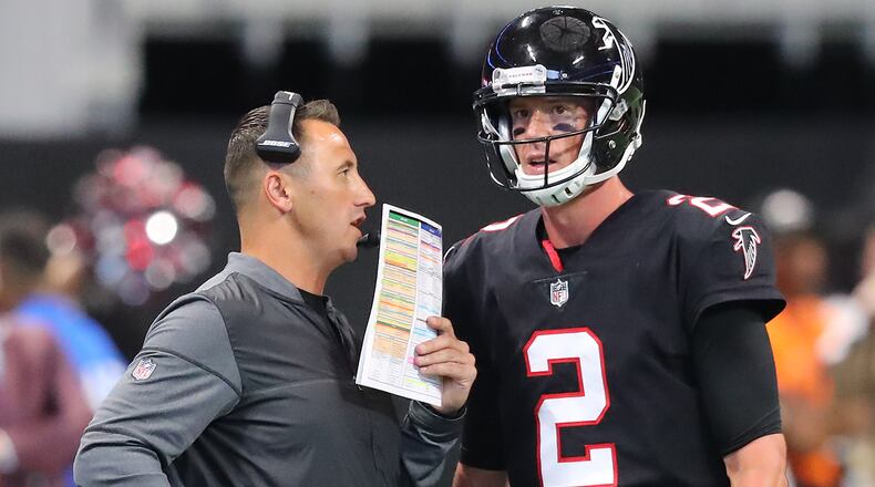 October 1, 2017 Atlanta: Falcons offensive coordinator Steve Sarkisian confers with quarterback Matt Ryan during a time out in the second half against the Bills in a NFL football game on Sunday, October 1, 2017, in Atlanta.   Curtis Compton/ccompton@ajc.com