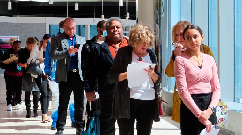 FILE - Applicants line up at a job fair at the Ocean Casino Resort in Atlantic City N.J., on April 11, 2022. (AP Photo/Wayne Parry, File)