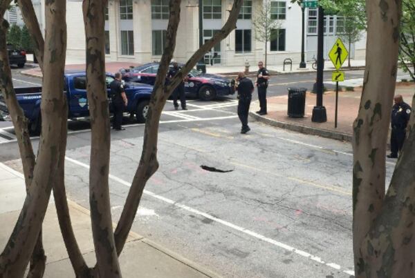 The sinkhole appeared on 5th Street in Midtown on April 19. (Credit: Zach Al-Nasser)