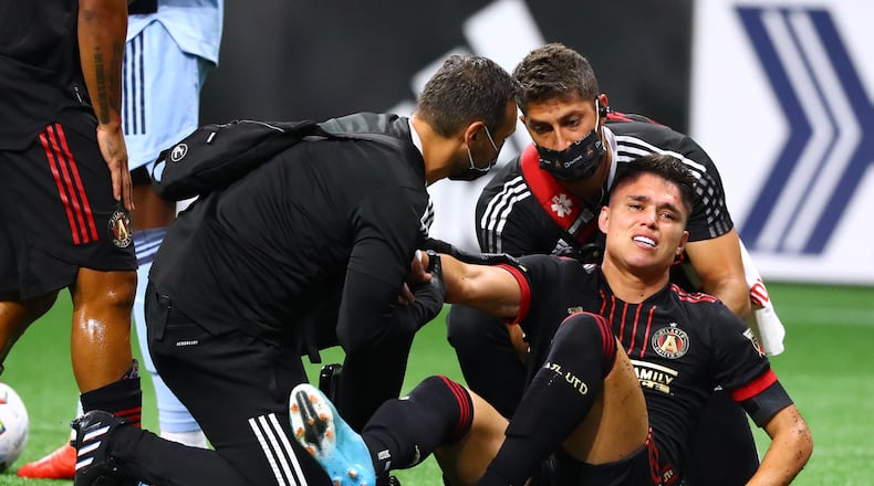 Atlanta United winger Luiz Araujo goes down on the pitch shortly after scoring a goal against Sporting KC in the season opener. Araujo trained with the team for the first time Tuesday since he suffered a hamstring strain in the first half of the first game. (Curtis Compton / Curtis.Compton@ajc.com)