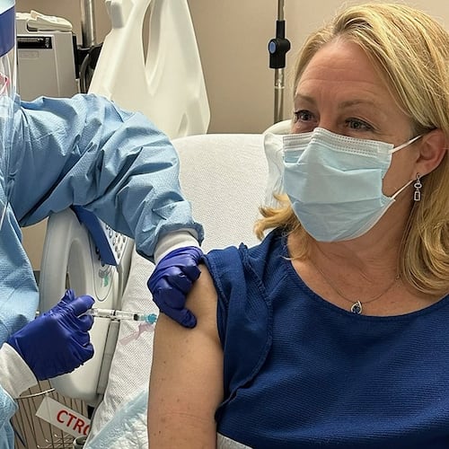 In this photo provided by Dr. Stacy Norton, she receives a trial vaccine for Lynch Syndrome at the MD Anderson Cancer Center Infusion Center in Houston, on April 11, 2023. (Courtesy Dr. Stacy Norton via AP)