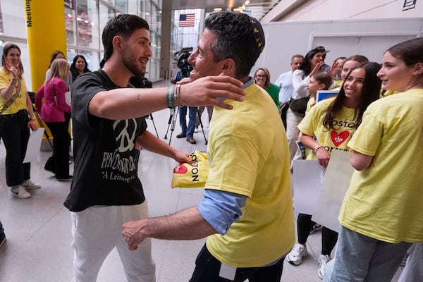 Omer Shem Tov, an Israeli hostage who survived over 500 days in Hamas captivity, is welcomed during his arrival at Logan Airport, Thursday, May 15, 2025, in Boston. (AP Photo/Charles Krupa)