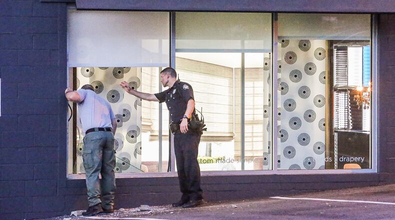 Atlanta police were on the scene of a smash-and-grab at the Shade Store on Mon., June 22, 2015. JOHN SPINK / JSPINK@AJC.COM