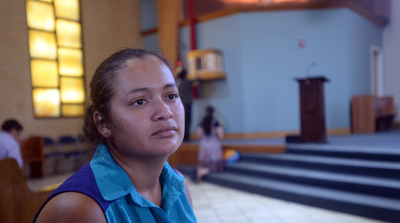 AUGUST 2, 2015 LILBURN Claudia Mariela Jurado is shown in the sanctuary of Our Lady of the Americas Catholic Mission in Lilburn Sunday, August 2, 2015. Jurado, a pregnant El Salvadorian woman who has been ordered deported for illegally entering the U.S., has fled to an Atlanta-area Catholic mission, where she is seeking sanctuary with her two young children. Jurado recently cut off the electronic monitoring bracelet immigration authorities had attached to her ankle. She absconded after she was asked to report to them Friday for her removal. Now living in a converted office at Our Lady of the Americas Catholic Mission in Lilburn, Jurado said she left El Salvador because a gang extorted money from her there. A Catholic, she said she will stay at the mission until “God decides” otherwise. “I’m afraid for my life,” she said through an interpreter Sunday about the possibility of returning to her native country. KENT D. JOHNSON /KDJOHNSON@AJC.COM