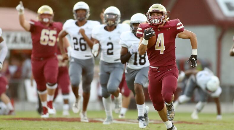 On the run: Brookwood running back Eli Kohl runs for a 68-yard touchdown in the first half of a home game against South Gwinnett. (Jason Getz/Special)