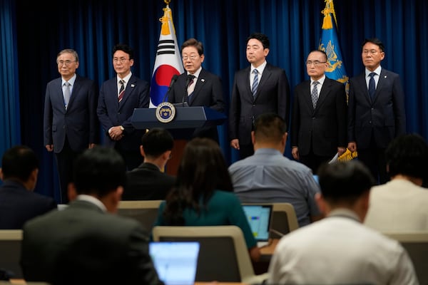 South Korean new President Lee Jae-myung, third from right, speaks during a press conference with top aides at the presidential office in Seoul, South Korea, Wednesday, June 4, 2025. (AP Photo/Ahn Young-joon, Pool)