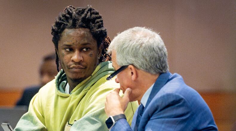 Atlanta rapper Young Thug talks to defense attorney Brian Steel during jury selection in the “Young Slime Life” gang case at the Fulton County Courthouse Tuesday, September 12, 2023.  (Steve Schaefer/steve.schaefer@ajc.com)