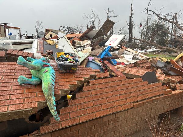 Debris covers a home at Lake City, Ark., on Thursday, April 3, 2025. (AP Photo/Adrian Sainz)